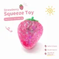 Pink strawberry-shaped squishy stress relief toy with colorful glitter and slow rebound feature - Pink Strawberry