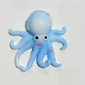 Jouet anti-stress pieuvre bleu clair translucide décoré de petites étoiles colorées - Motif Poulpe / Bleu et Blanc