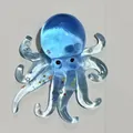 Jouet de décompression pieuvre bleue translucide avec de petites étoiles colorées - Motif Poulpe / Bleu transparent