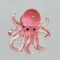 Jouet à presser poulpe rose translucide avec des étoiles colorées à l'intérieur. - Motif Poulpe / Rouge Transparent