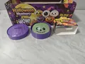 Close-up of Halloween glitter squishy toy in steamed bun shape with purple basket - Halloween Glitter Burst Giant Bun (Style C)