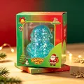 Close-up of a blue glitter Santa Claus squishy stress relief toy in Christmas themed packaging - Blue Santa Claus Squishy Toy (Boxed)