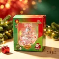 Close-up of Christmas tree squishy toy with glitter in festive window packaging box - Pink Christmas Tree Squishy Toy (Boxed) / Pink