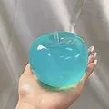 Blue translucent apple squishy toy for stress relief and relaxation held in hand - Blue Apple