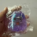 Süßes lilafarbenes Glitzer-Gespenst-Squishy-Stressabbauspielzeug für Halloween-Partys - Paillettengeist-Lächeln Stil / Lila