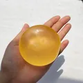 Balle anti-stress translucide jaune orangé à l'huile de coco fruitée jouet squishy. - Balle Jaune Fait Main / 6cm