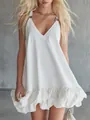 Detailed view of white mini dress with V-neck, ruffle hem, and metal strap buckles - XS / Dresses / White
