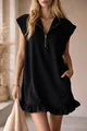 Close-up detail of a chic black sleeveless ruffle hem dress with a zipper V-neckline - XS / Dresses / Black