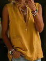 Close-up detail of a yellow sleeveless cotton linen shirt with elegant ruffled stand collar - Earthy Yellow