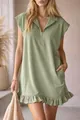 Detailed view of sage green sleeveless dress with zipper neckline and ruffle hem - Light Green
