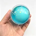 Blue translucent stress relief squishy ball toy with decorative stars and hearts - Crispy Ball / Glitter Pulp Blue