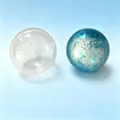 Handmade crispy stress relief toy balls featuring clear and blue speckled variants - Gold Powder Crispy Squishy Ball / Blue