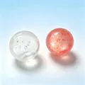 Pair of translucent and speckled pink crispy stress relief balls for relaxation - Gold Powder Crispy Squishy Ball / Orange