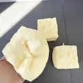 Close-up of handmade cheese-shaped squishy toys being squeezed for stress relief and fun - Square Cheese / 7cm