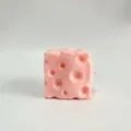 Realistic pink cheese-shaped squishy stress relief toy featuring soft hole texture details - Square Cheese / 7cm / Pink