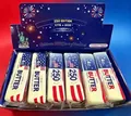 Detalle de juguetes antiestrés con forma de mantequilla en caja de 12 piezas - Tema del 250 Aniversario