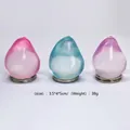 Trois jouets anti-stress colorés en forme de poire en rose, bleu et violet vif - Maltose de Goutte d'Eau