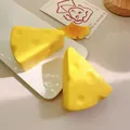 Close-up detail of yellow triangle cheese squishy toy showing realistic porous texture - Triangle Cheese / OPP Bag