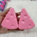 Close-up detail of cute pink cheese-shaped slow rebound squishy stress relief toy - Triangle Cheese Style / 7cm Size / Pink