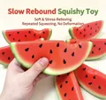Close-up of watermelon slice squishy toy showing soft PU texture - Watermelon