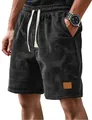 Close-up of men's casual waffle knit shorts with drawstring and grey checkered pattern - M / Bottoms / Black