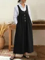 Elegant black button-down pinafore dress layered over a white long-sleeve shirt - S / Dress (Y3260) / Black