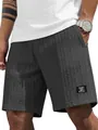 Detail view of dark gray men's casual shorts featuring a unique cable-knit texture - S / Bottoms / Black