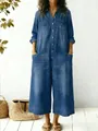 Detailed shot of a casual loose blue denim jumpsuit with single-breasted buttons - S / Dresses / Blue