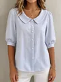 Detailed view of blue and white striped blouse with Peter Pan collar and puff sleeves - S / Tops / Light Blue