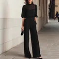 Elegant black two-piece set featuring sheer puff sleeve top and high-waisted trousers - XS / Top And Bottom / Black