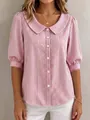Detail view of a pink and white striped shirt featuring a Peter Pan collar and white buttons - S / Tops / Pink
