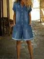 Detail view of washed denim romper with multiple pockets and button-down front - S / Set / Blue
