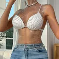 Macro detail of silver sparkly rhinestone fishnet top with intricate mesh pattern - Silver