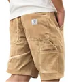 Close-up of men's khaki corduroy cargo shorts showing pocket detail and fabric texture - S / Bottoms / Khaki