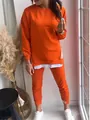Stylish orange two-piece tracksuit set with faux layered sweatshirt and matching joggers - S / Top And Bottom / Orange