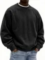 Close-up of black corduroy sweatshirt featuring ribbed texture and round neck detail. - Black