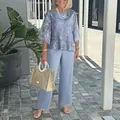 Elegant light blue chiffon two-piece outfit featuring floral print top and wide-leg pants - S / Top And Bottom