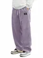 Détail du pantalon en velours côtelé violet pour homme, coupe ample avec cordon serrage - Violet