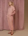 Full-length view of a stylish pink casual jumpsuit with front zipper and layered sleeves - XS / Set / Pink