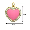 Close-up of pink enamel heart pendant with crystals showing 16mm x 15mm size - Gold Frame Pink Heart With Zirconia Style (4)