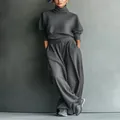 Full-length view of a women's dark grey loose high-neck sweatshirt and wide-leg pant set - S / Top And Bottom / Dark Gray
