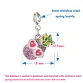 Macro view of a vacation-style pink glitter sunglasses charm with detailed dimensions - Pineapple with Silver Clasp