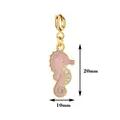 Detailed macro shot of a pink enamel seahorse charm showing 20mm by 10mm dimensions - Seahorse With Spring Clasp / 20mmx10mm