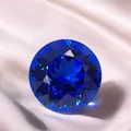 Brilliant round cut synthetic cobalt blue spinel gemstone on silk background - Round / 4mm (Approx 0.3ct) / Cobalt Blue