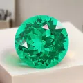 Pierre précieuse d'émeraude de laboratoire taillée en rond avec une couleur vert vif - Style Rond / 6mm (Environ 0,63-0,78ct) / Vert Muzo (Inclusions Légères)