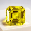 Emerald cut lab-grown yellow sapphire gemstone on white stand - Asscher Cut / 6mm (Approx. 1.1ct) / Gold Yellow