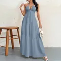 Elegant dusty blue halter neck tiered maxi dress shown in full length on a model - S / Dresses / Sky Blue