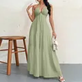 Elegant sage green halter neck tiered maxi dress with deep V-neck and flowy hemline - Light Green