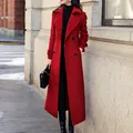 Detail of a full-length slim fit red wool coat for women in an outdoor city setting - S / Tops / Red