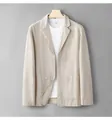 Lightweight men's linen blazer in beige, hanging against a grey wall - M / Tops / Apricot